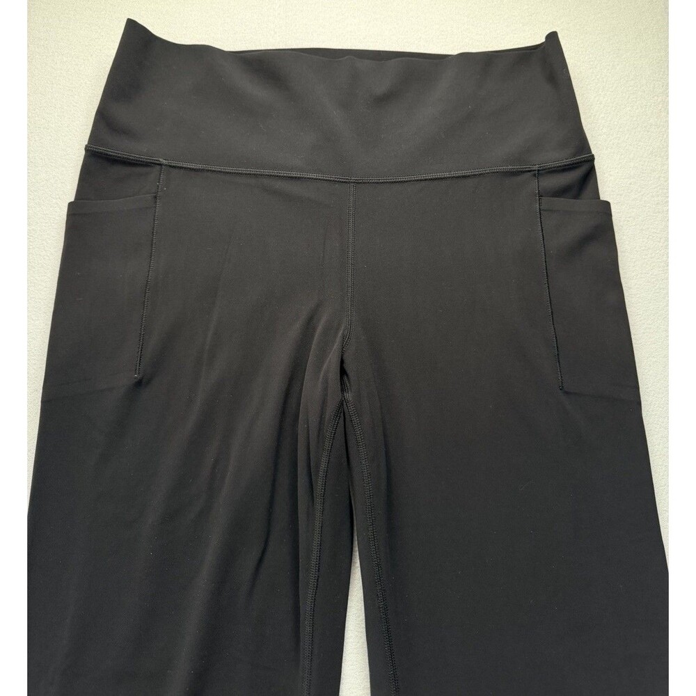 Athleta Salutation Stash Flare Pant XL Black Yoga Leggings Pockets Stretch - Picture 7 of 14